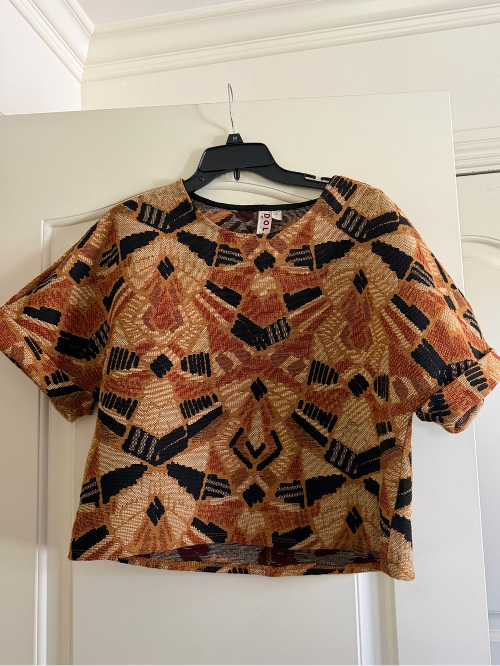 Anthropologie Geometric Pattern Short-Sleeve Top in Rust and Black